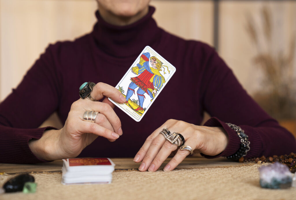 Nine of Wands tarot card meaning upright and reversed interpretation